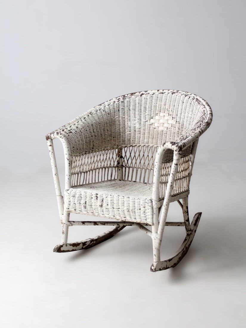 Barrel Back Wicker Rocker with Lattice Sides and Diamond Panel: Barrel Back Wicker Rocker with Lattice Sides and Diamond Panel This antique American wicker rocking chair features a rounded barrel back, open lattice sides, and softly flared arms on a classic rocker