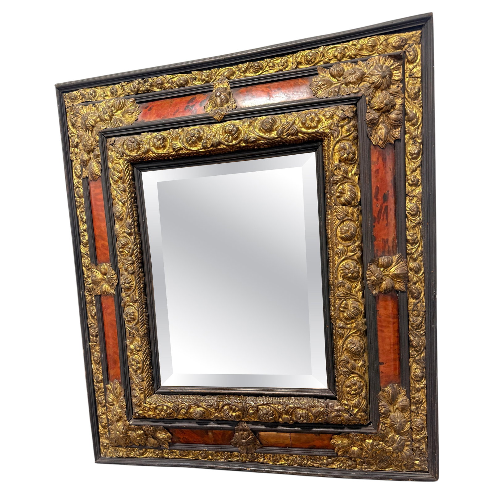 French Early 19th Century Beveled Mirror With Embossed Brass and Faux Tortoiseshell: French Early 19th Century Beveled Mirror With Embossed Brass and Faux Tortoiseshell This early 19th-century French wall mirror from the Napoleon III period features a distinctive architectural frame c