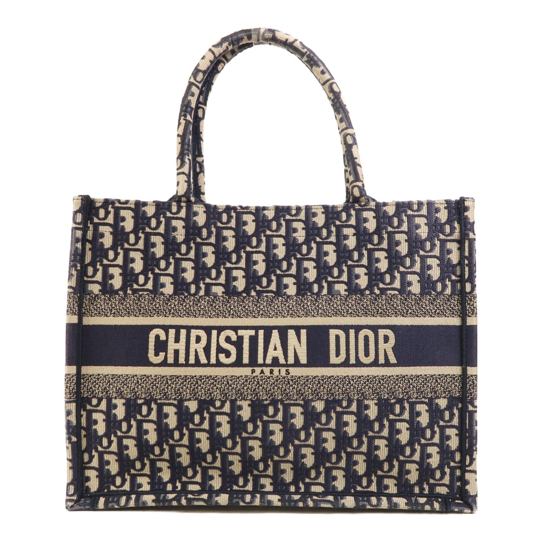 Dior Book Tote Medium Canvas Navy M1296ZRIW_M828 French Handbag: Dior Book Tote Medium Canvas Navy M1296ZRIW_M828 French Handbag This Christian Dior Book Tote Medium is crafted from navy canvas and features a spacious open-top design. Made in France, the tote showc