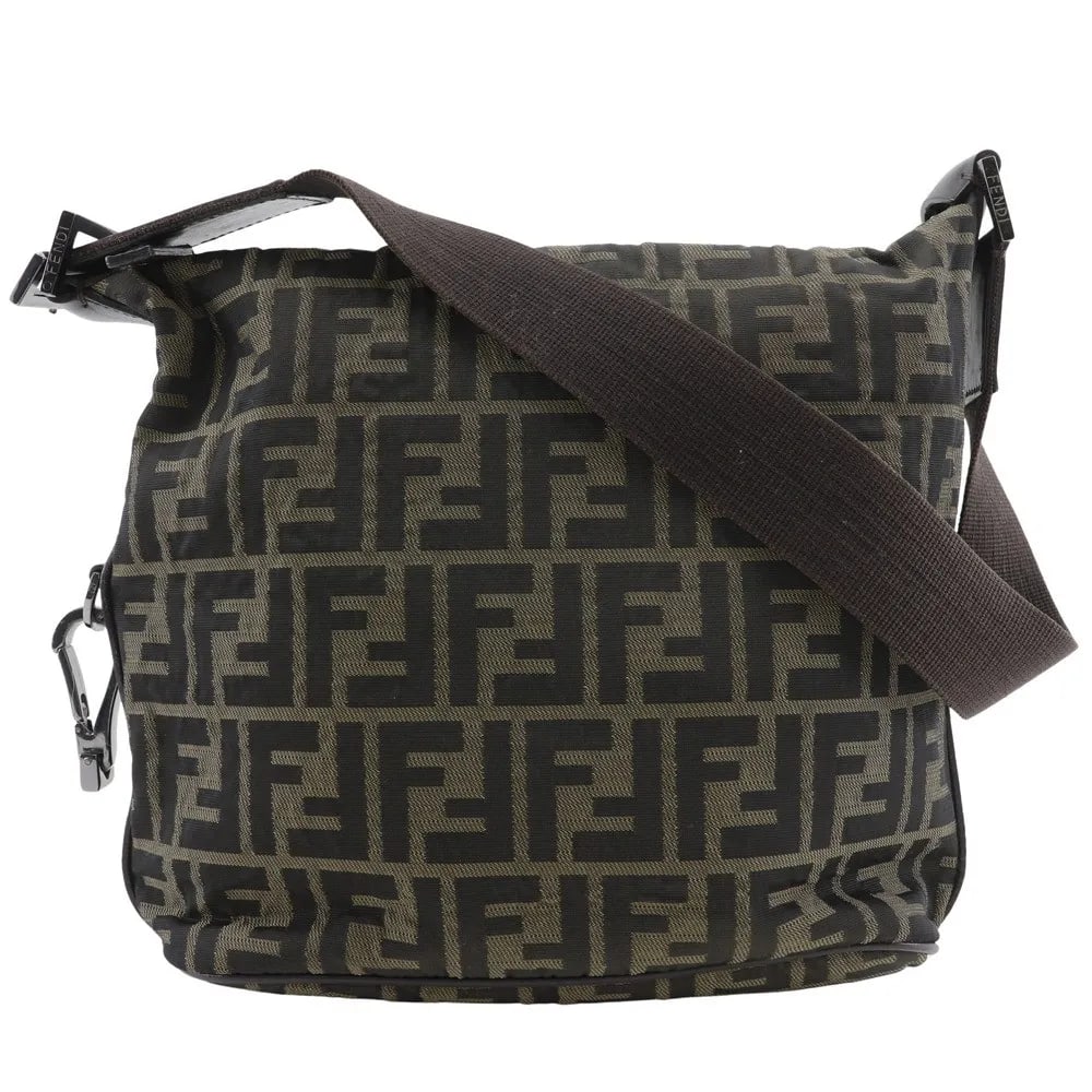 Fendi Logo Zucca Brown Canvas Shoulder Bag: Fendi Logo Zucca Brown Canvas Shoulder Bag This Fendi Logo Zucca Shoulder Bag features the iconic Zucca motif in brown canvas. Designed for women, it offers a classic and stylish look. The bag is in v