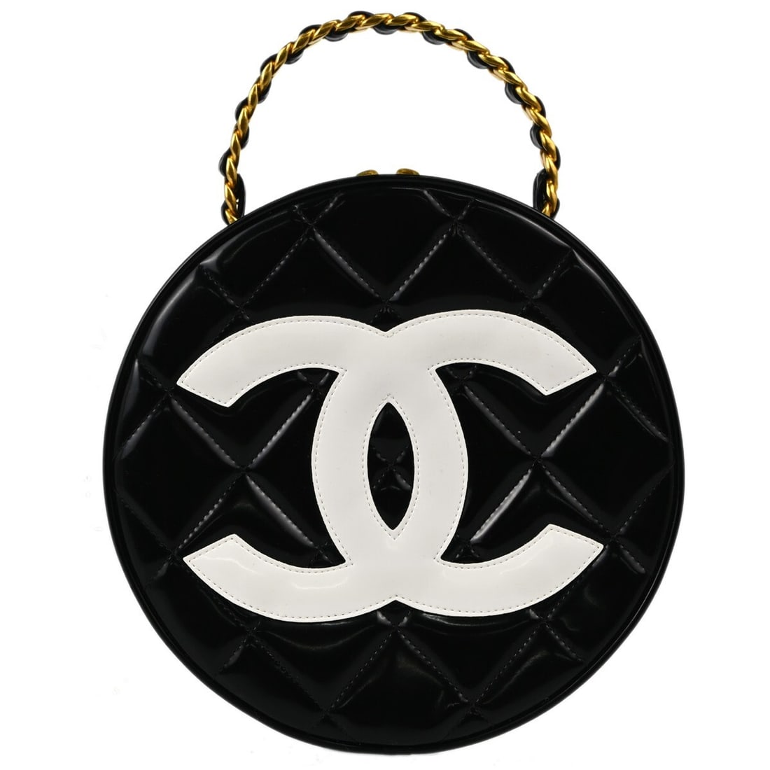 CHANEL Quilted Round Vanity Top Handle Bag in Black Patent Leather: CHANEL Quilted Round Vanity Top Handle Bag in Black Patent Leather Round Chanel vanity handbag in black patent leather with a zip closure and top handle design. The bag includes one interior pocket an