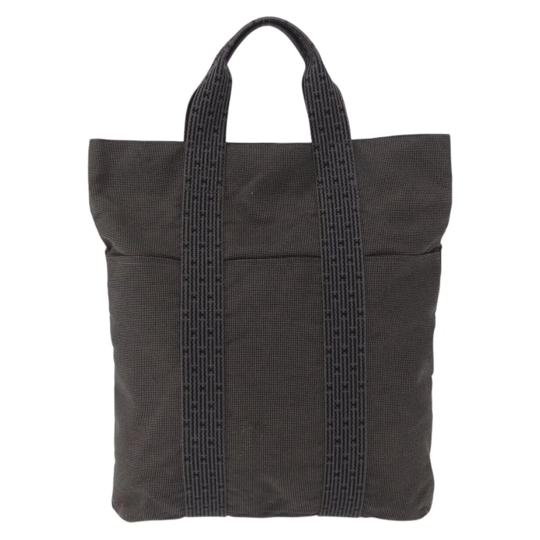 Fourre-tout Herline gray canvas tote bag by Hermes: Fourre-tout Herline gray canvas tote bag by Hermes This Hermes Fourre-tout Herline tote is crafted from durable gray canvas and designed for women. Made in France, it features practical handles and me