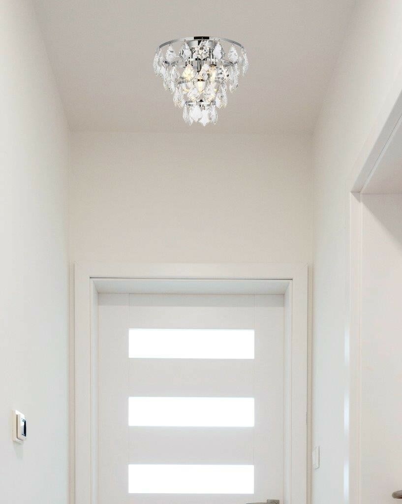 Living District Ella 3-Light Chrome Flush Mount Crystal Chandelier: Living District Ella 3-Light Chrome Flush Mount Crystal Chandelier This modern flush mount chandelier features a chrome finish and is adorned with royal cut clear crystal pendant drops, creating a str