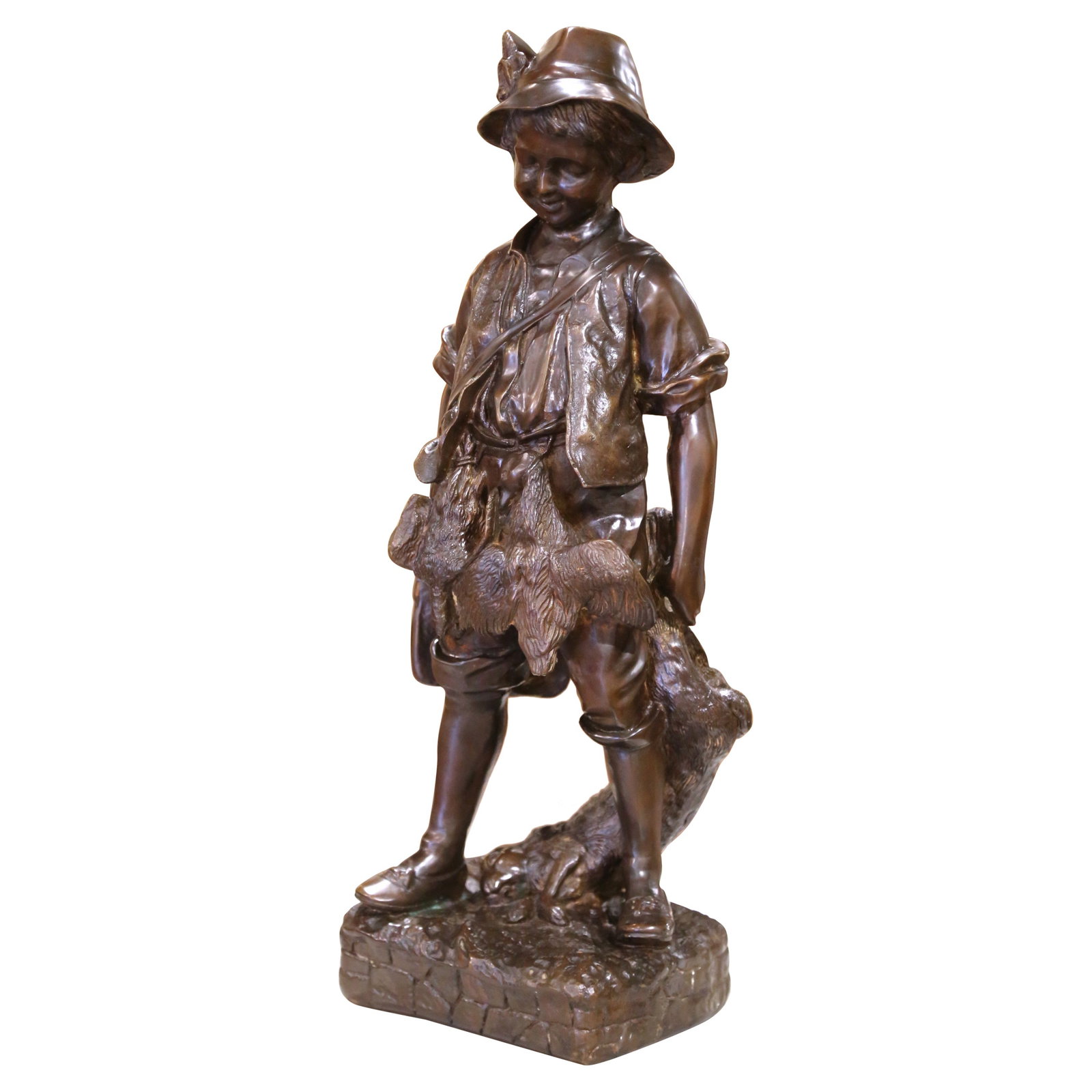 French Bronze Figure of Boy Hunter with Hare Mid-20th Century Patinated Sculpture: French Bronze Figure of Boy Hunter with Hare Mid-20th Century Patinated Sculpture This mid-century French bronze sculpture, cast circa 1950, features a young hunter in rustic attire holding a hare. Cr