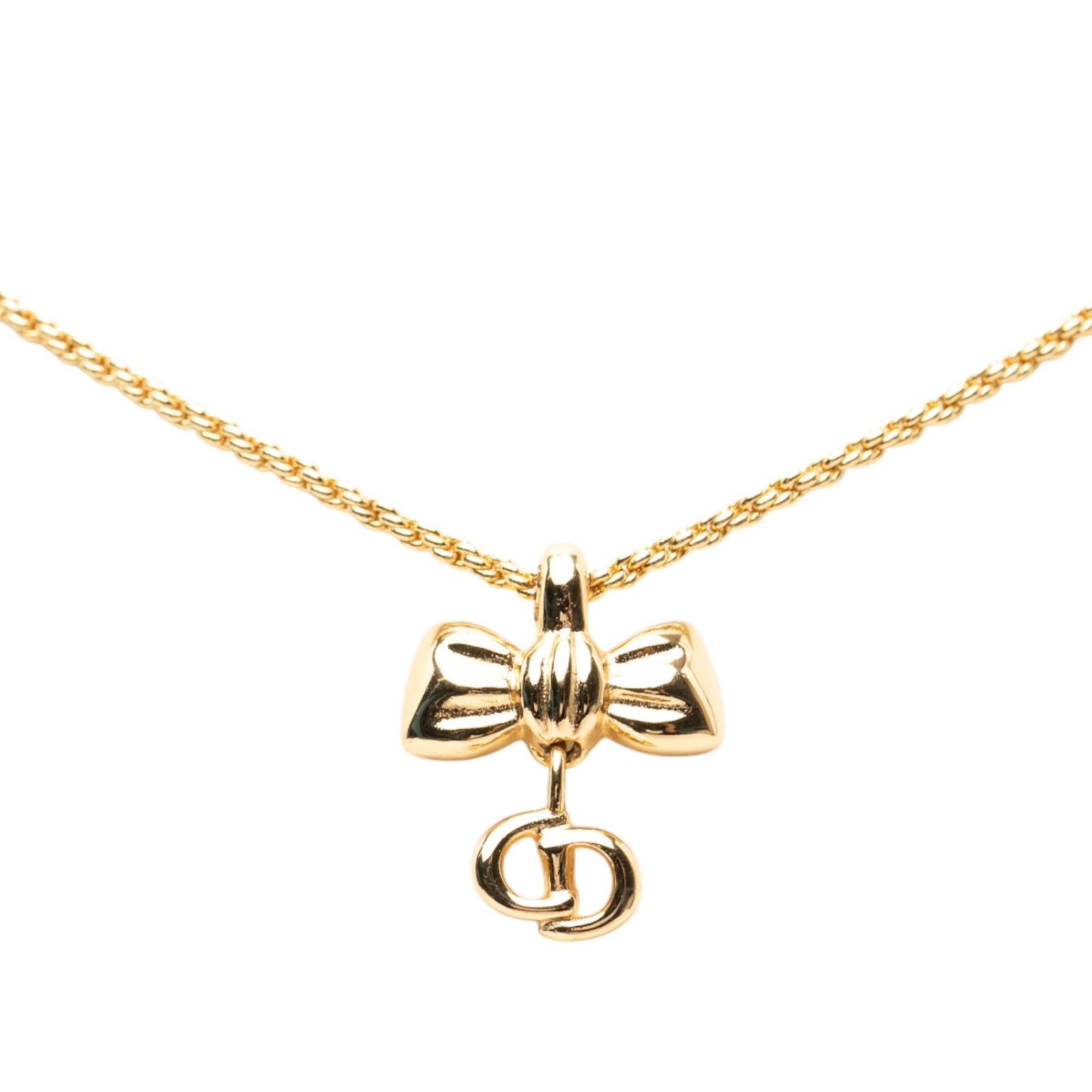 Dior CD Logo Ribbon Pendant Necklace in Gold Plated Metal: Dior CD Logo Ribbon Pendant Necklace in Gold Plated Metal Dior ribbon CD logo pendant necklace in gold plated metal with a spring ring closure. This costume jewelry piece is made in Germany. Condition