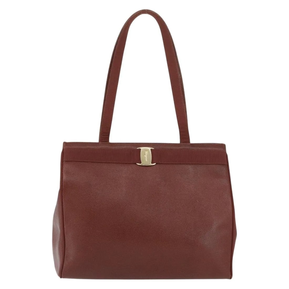 Brown Embossed Leather Vala Tote by Salvatore Ferragamo: Brown Embossed Leather Vala Tote by Salvatore Ferragamo This Salvatore Ferragamo Vala tote features embossed brown leather and is designed for women. The bag showcases a spacious interior and classic 
