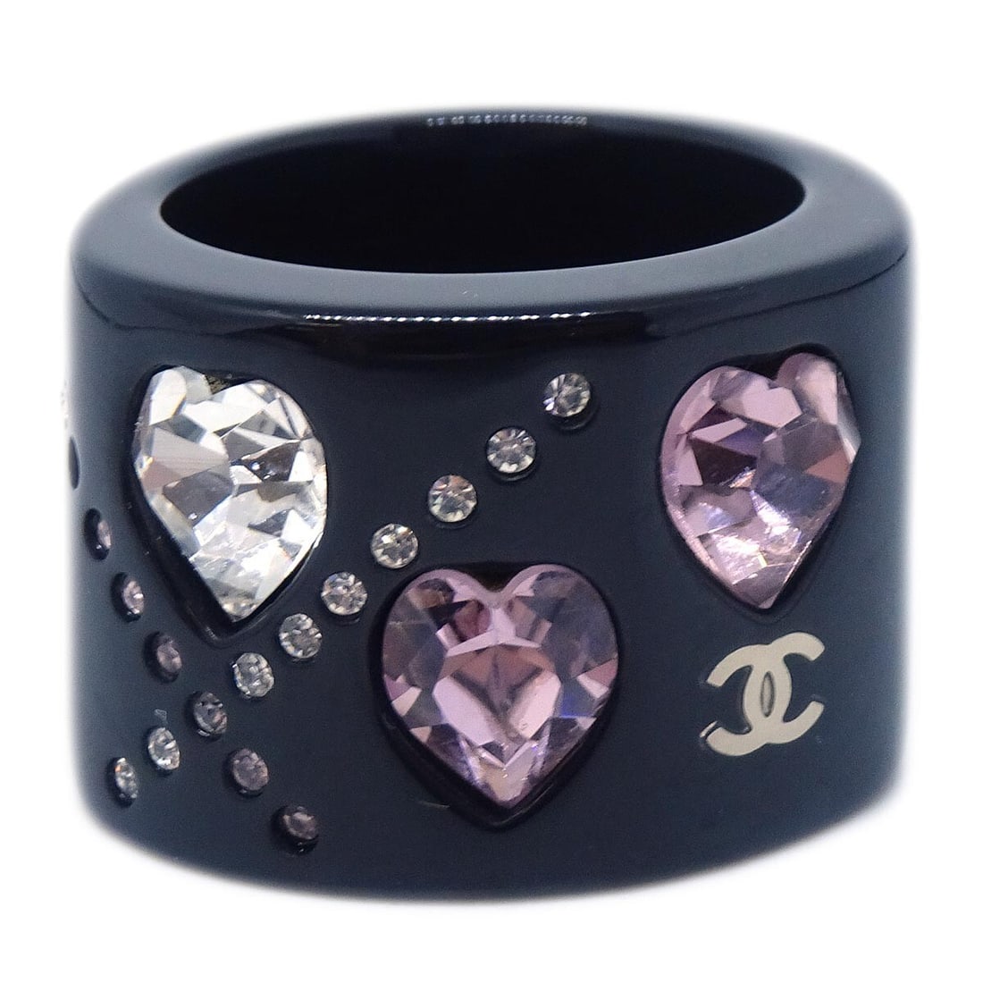 Vintage Chanel Size 13 Ring in Black Acrylic with Rhinestones: Vintage Chanel Size 13 Ring in Black Acrylic with Rhinestones Vintage Chanel ring in black acrylic with rhinestone detailing. Marked 04A, this ring is made in France and is presented in excellent cond
