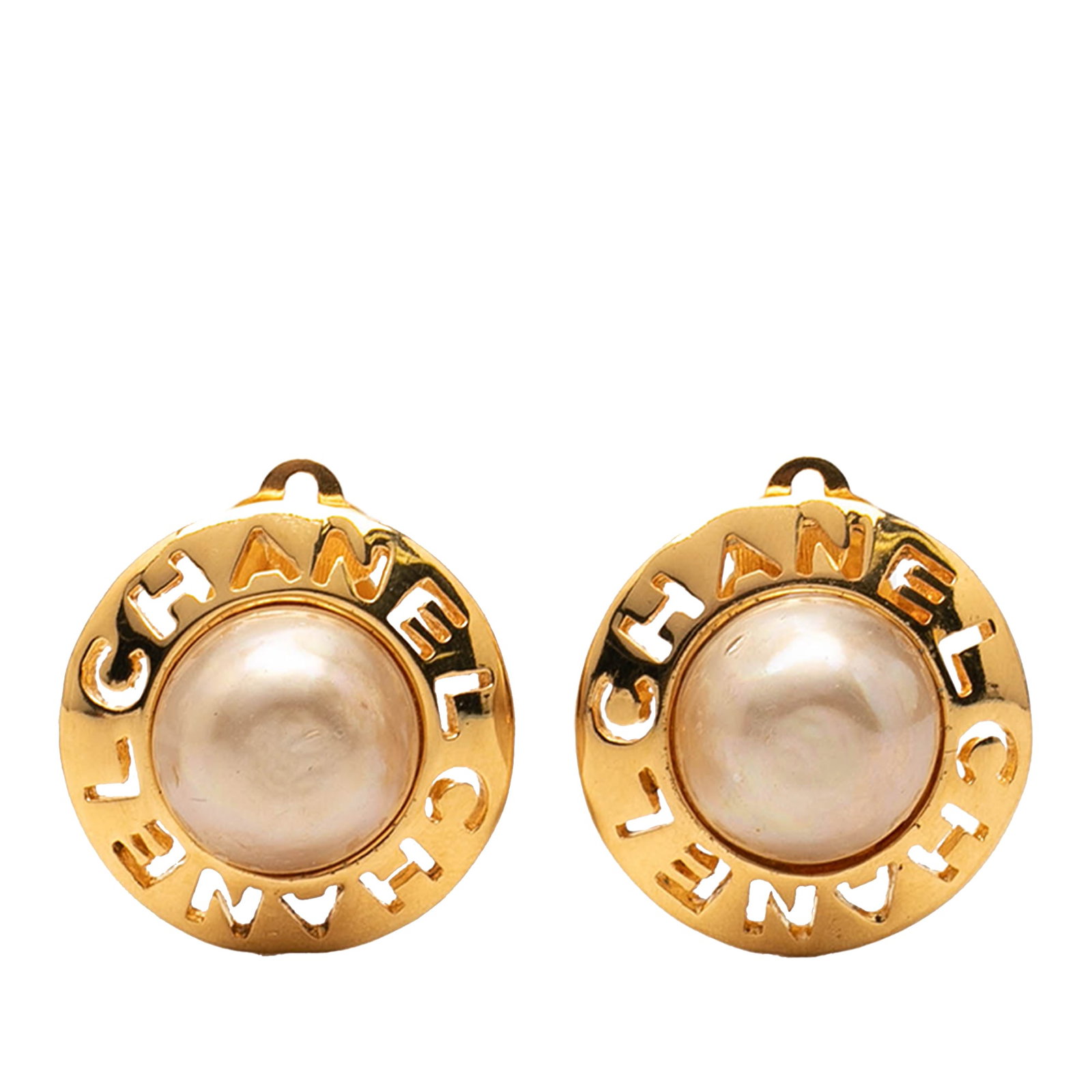 Chanel faux pearl round clip on earrings gold plated: Chanel faux pearl round clip on earrings gold plated These Chanel round clip-on earrings feature gold-plated metal bodies adorned with faux pearl accents. The earrings are designed with secure back cl