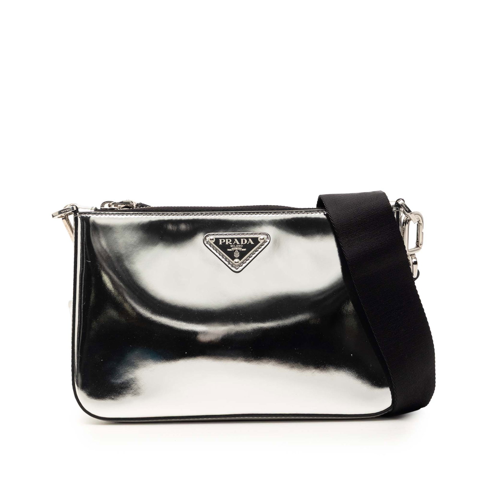 Silver Leather Crossbody with Zip Top and Pouch by Prada Re Edition: Silver Leather Crossbody with Zip Top and Pouch by Prada Re Edition This Prada Brushed Leather Re Edition Zip Messenger Bag features a metallic leather exterior in silver, an adjustable and detachable