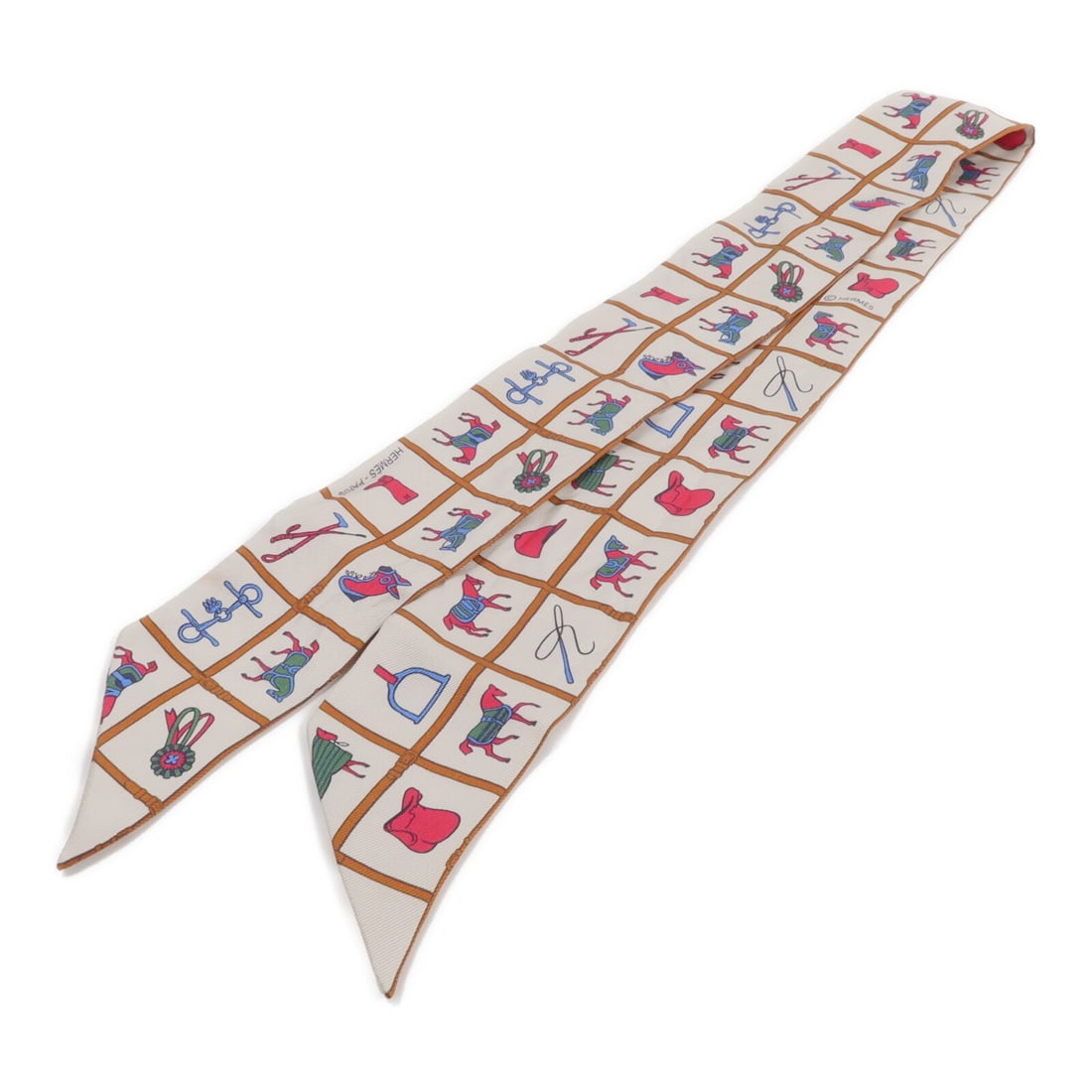 Hermes silk Twilly scarf brown beige: Hermes silk Twilly scarf brown beige This Hermes Twilly scarf is crafted from luxurious silk in a brown and beige color palette. Designed for women, it offers a stylish and versatile accessory option.