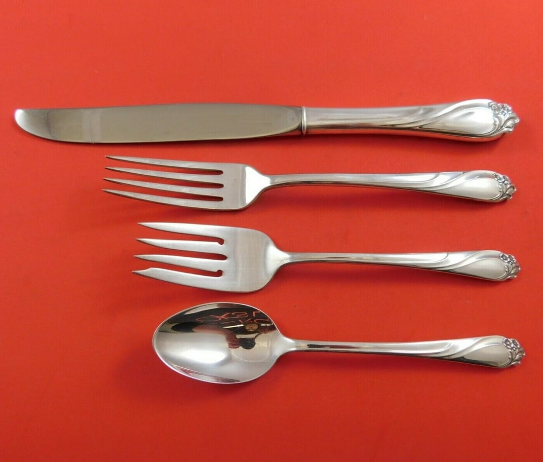International Sterling Silver Enchanted Rose 4-Piece Place Setting: International Sterling Silver Enchanted Rose 4-Piece Place Setting This exquisite 4-piece place setting from the Enchanted Rose pattern by International Sterling is a beautiful addition to any table. 