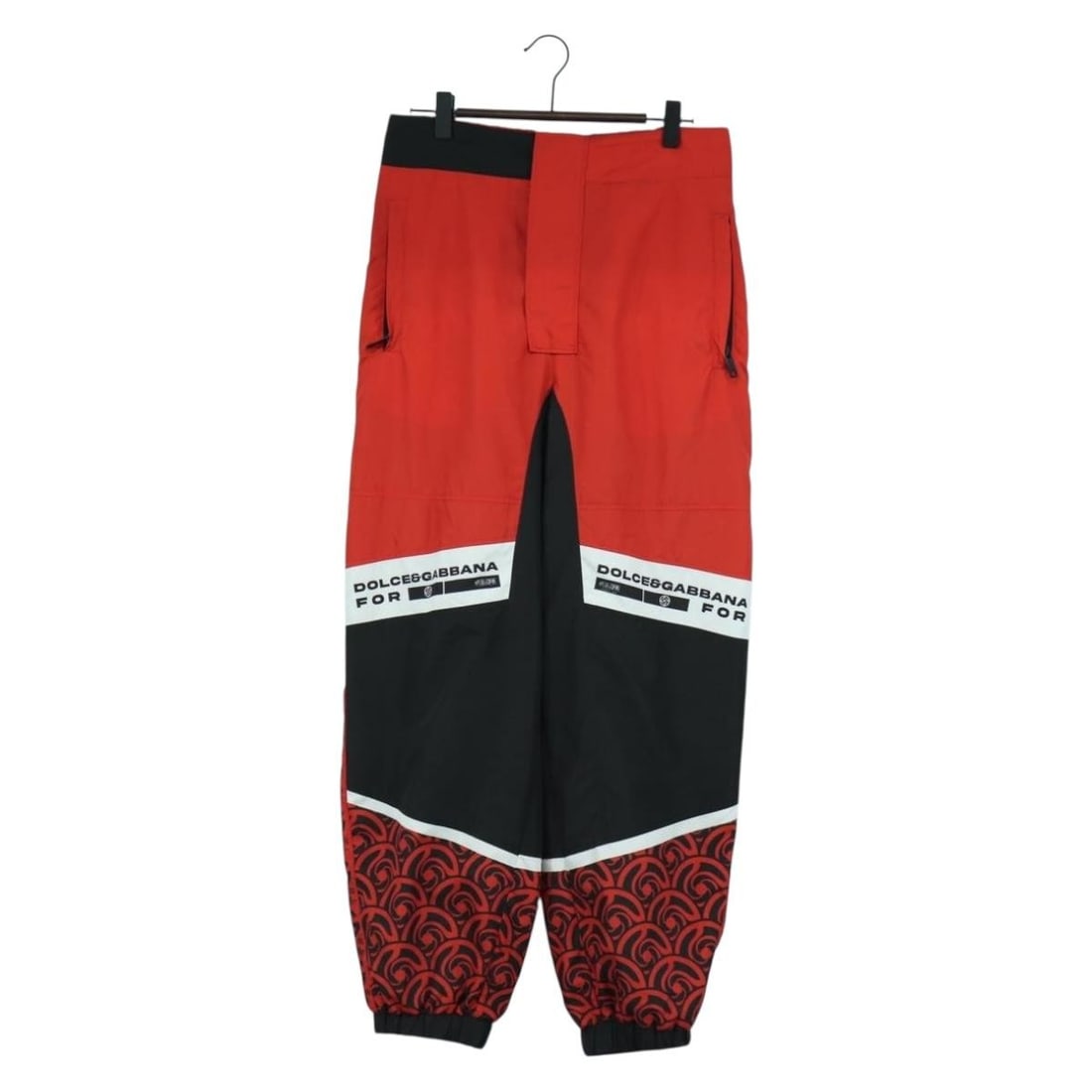Dolce & Gabbana Jujutsu Kaisen Red Nylon Women's Joggers Made in Italy: Dolce & Gabbana Jujutsu Kaisen Red Nylon Women's Joggers Made in Italy These Dolce&Gabbana x Jujutsu Kaisen jogger pants are crafted from durable nylon in a vibrant red color. Designed for women, they