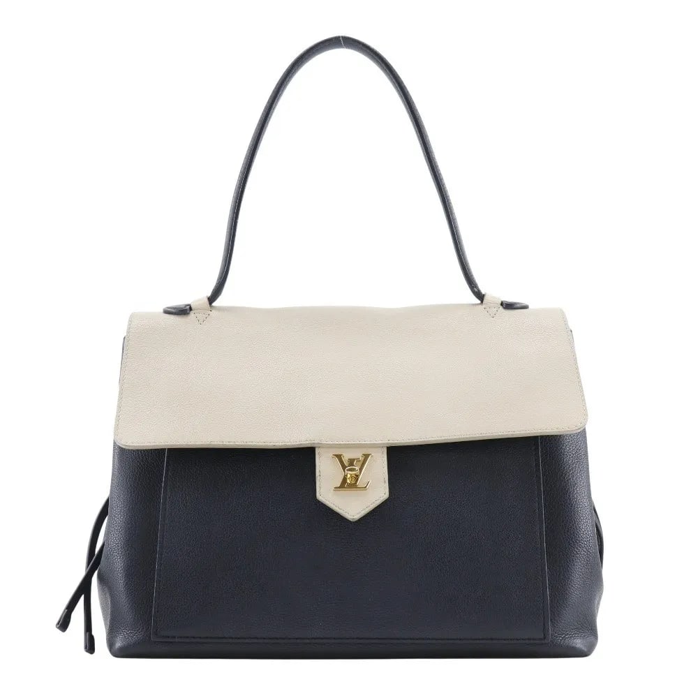 Louis Vuitton Lockme black leather handbag: Louis Vuitton Lockme black leather handbag The Louis Vuitton Lockme Handbag is crafted from black leather and designed for women. This handbag features a spacious interior with minor signs of use, inc