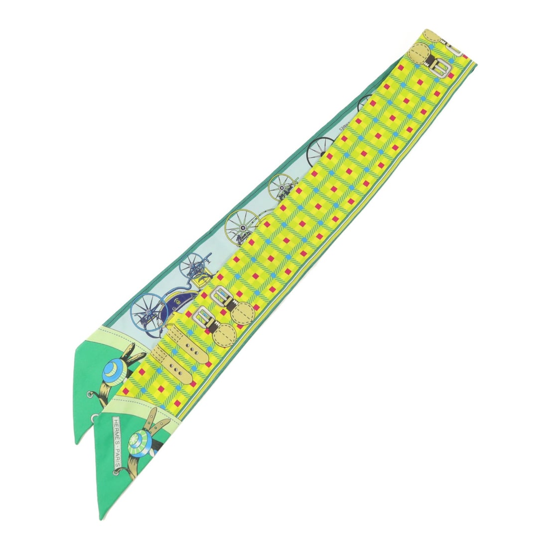 Hermes Silk Twilly in Green and Yellow: Hermes Silk Twilly in Green and Yellow This Hermes Twilly scarf is crafted from luxurious silk in green and yellow tones. Designed for women, it features a regular size and showcases the brand's renow