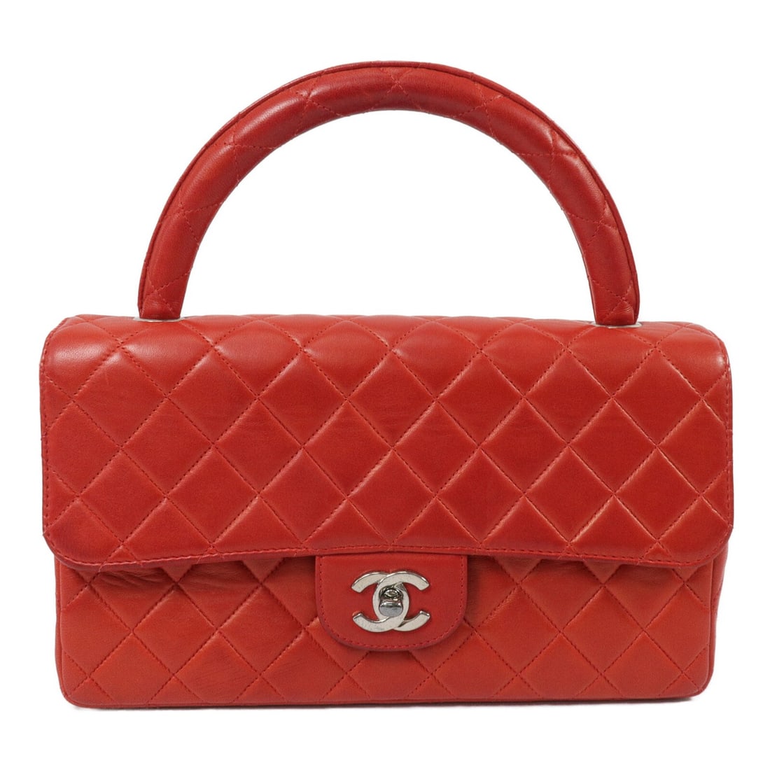 CHANEL Vintage Red Lambskin Handbag with CC and Silver Tone Hardware: CHANEL Vintage Red Lambskin Handbag with CC and Silver Tone Hardware Vintage CHANEL handbag in red lambskin leather with the signature CC design and silver-tone hardware. Designed for women, this regu