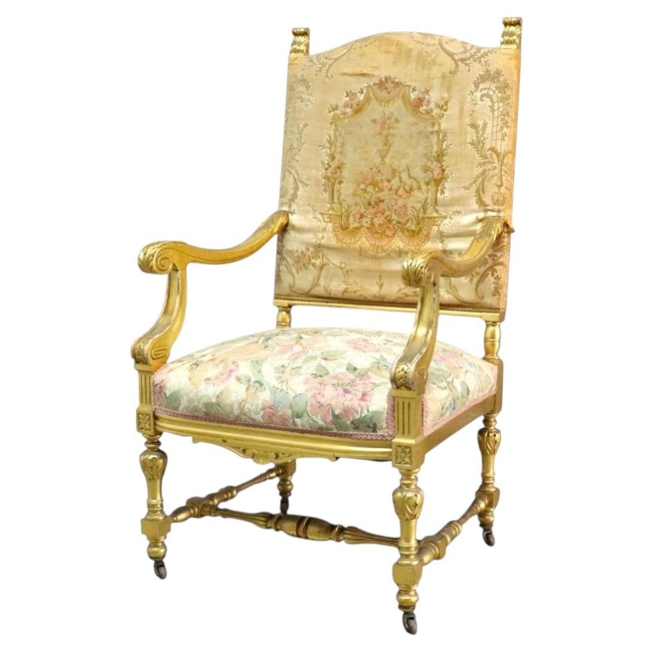French Louis XVI giltwood tapestry armchair c1910: French Louis XVI giltwood tapestry armchair c1910 This antique French armchair, crafted circa 1910, exemplifies the refined Louis XVI style. The chair features a finely carved giltwood frame with intr