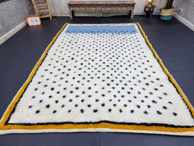 Authentic Handmade Moroccan Wool Rug 9.84 x 6.56 Feet: Authentic Handmade Moroccan Wool Rug 9.84 x 6.56 Feet Experience the elegance of this Stunning Handmade Wool Rug, meticulously handwoven in the Atlas Mountains by skilled Berber women weavers. Crafted