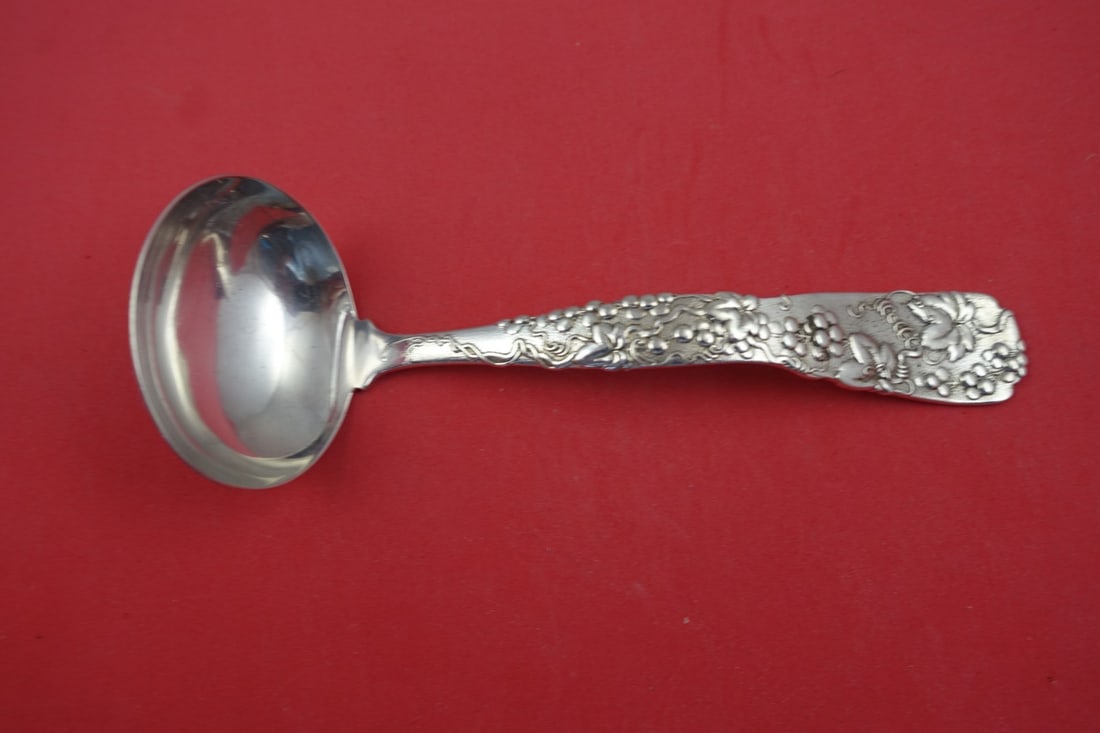 Tiffany & Co. Vine Sterling Silver Gravy Ladle 8 Inch Grape Motif: Tiffany & Co. Vine Sterling Silver Gravy Ladle 8 Inch Grape Motif Experience timeless elegance with this exquisite gravy ladle from the Vine pattern by Tiffany & Co. Crafted from high-quality sterling
