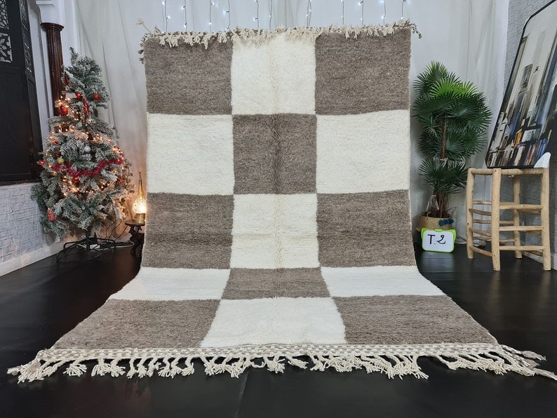 Handmade Moroccan Berber Wool Rug 9.84 x 6.56 Feet: Handmade Moroccan Berber Wool Rug 9.84 x 6.56 Feet Experience the beauty of this stunning handmade Moroccan Berber rug, featuring a captivating geometric design. Crafted by skilled local Berber women 