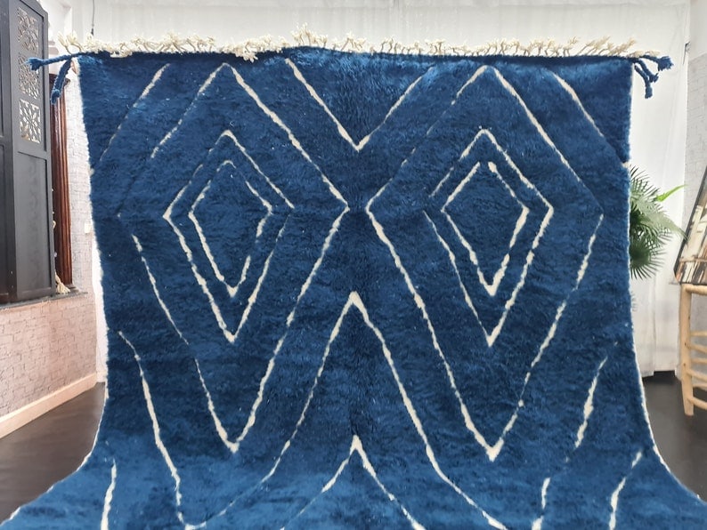 Authentic Handmade Moroccan Berber Wool Rug with White Geometric Pattern: Authentic Handmade Moroccan Berber Wool Rug with White Geometric Pattern Discover the beauty of this authentic handmade Moroccan Berber wool area rug, featuring a stunning dark blue base adorned with 