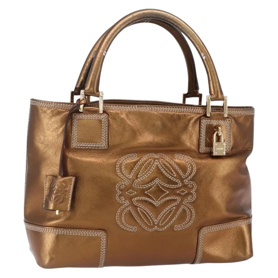 Metallic Leather Vintage Anagram Tote Bag by Loewe: Metallic Leather Vintage Anagram Tote Bag by Loewe This Loewe Vintage Anagram Tote is crafted from metallic leather and designed for women. The bag features the iconic Anagram motif and is made in Spa