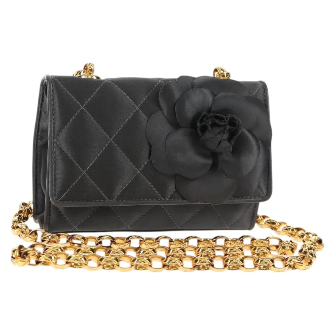 Gray Satin Chanel Camellia Flap Shoulder Bag Vintage Style: Gray Satin Chanel Camellia Flap Shoulder Bag Vintage Style This vintage Chanel Camellia Flap Bag for women features a gray satin exterior with a matelasse chain shoulder strap. The bag is pre-owned an