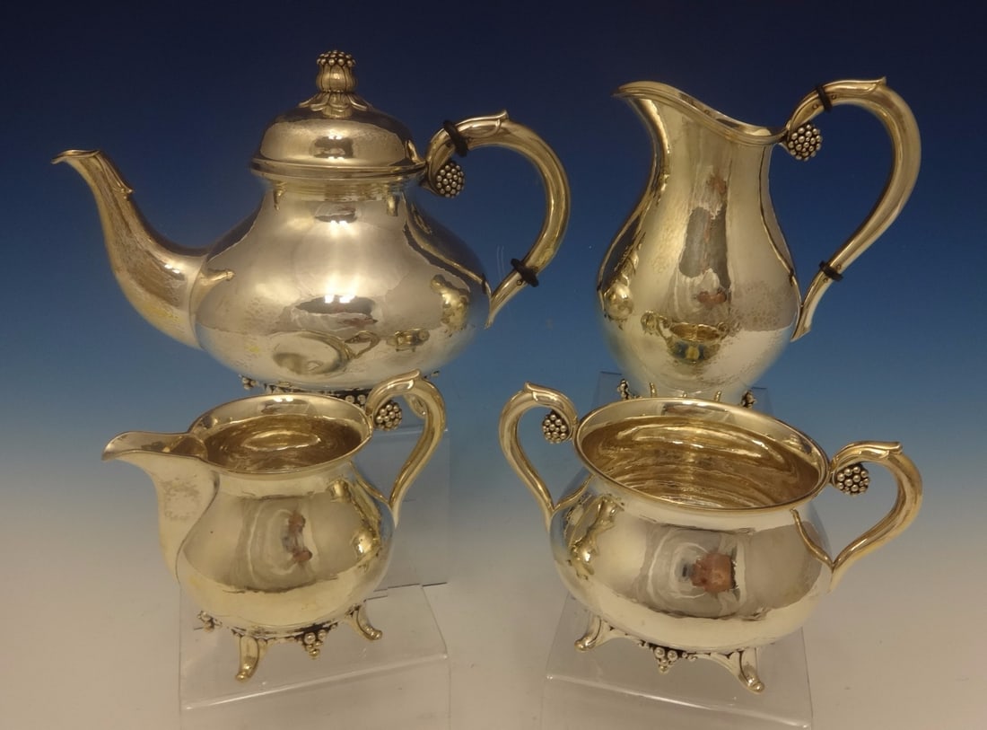 Grann & Laglye Grape 4pc Sterling Silver Tea Set Scandinavia: Grann & Laglye Grape 4pc Sterling Silver Tea Set Scandinavia This exquisite four-piece tea set, crafted by Grann & Laglye, showcases the beautiful Grape pattern in sterling silver. Dating back to the 