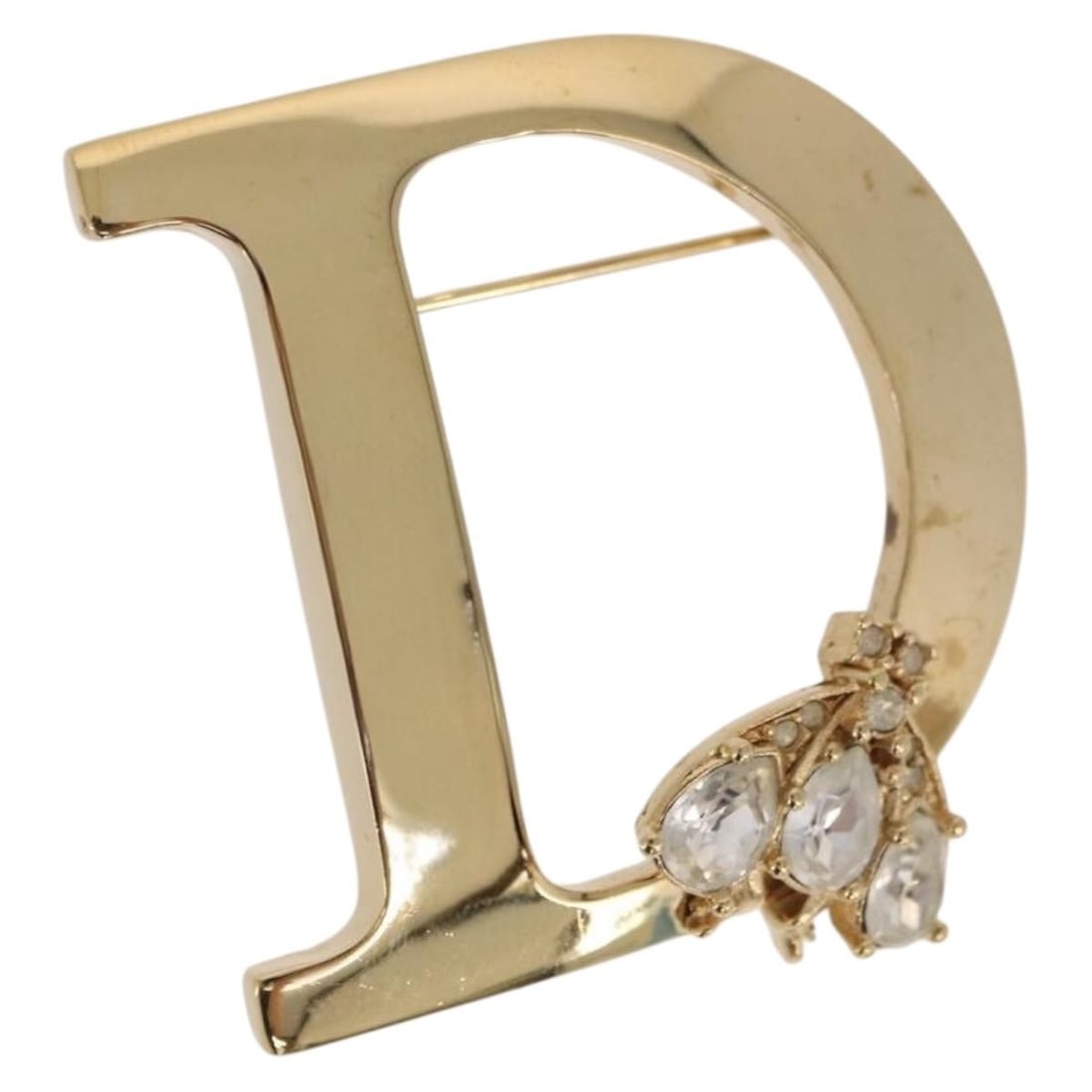 Christian Dior Gold Tone Metal Brooch with Rhinestones: Christian Dior Gold Tone Metal Brooch with Rhinestones Christian Dior brooch in gold-tone metal with rhinestone detailing. This women's accessory comes with the dust bag and item box. Condition is rat