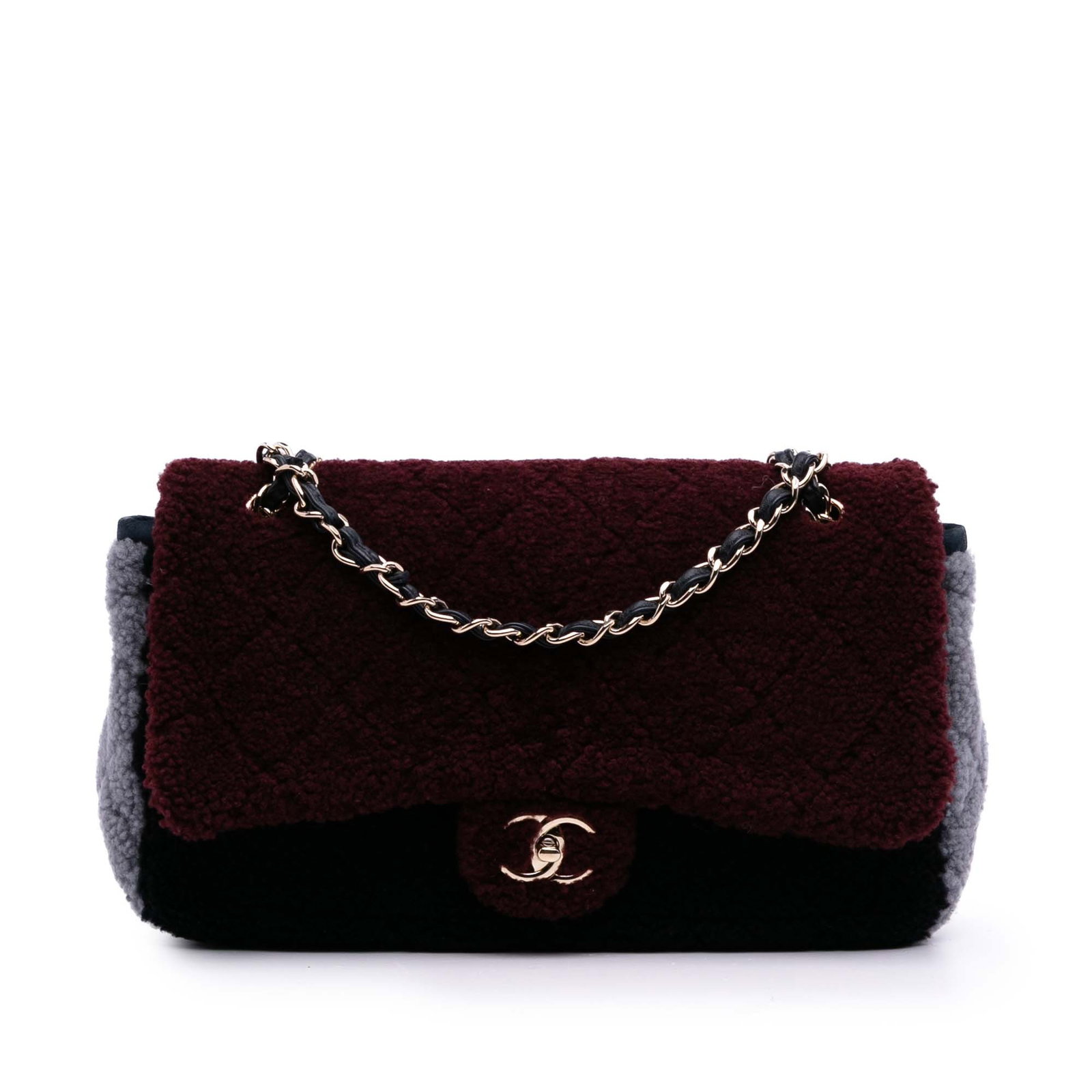 Chanel Medium Tricolor CC Quilted Shearling Flap Bag Red: Chanel Medium Tricolor CC Quilted Shearling Flap Bag Red This Chanel Medium Quilted Shearling Single Flap bag showcases a luxurious shearling body complemented by leather trim. It features an elegant 