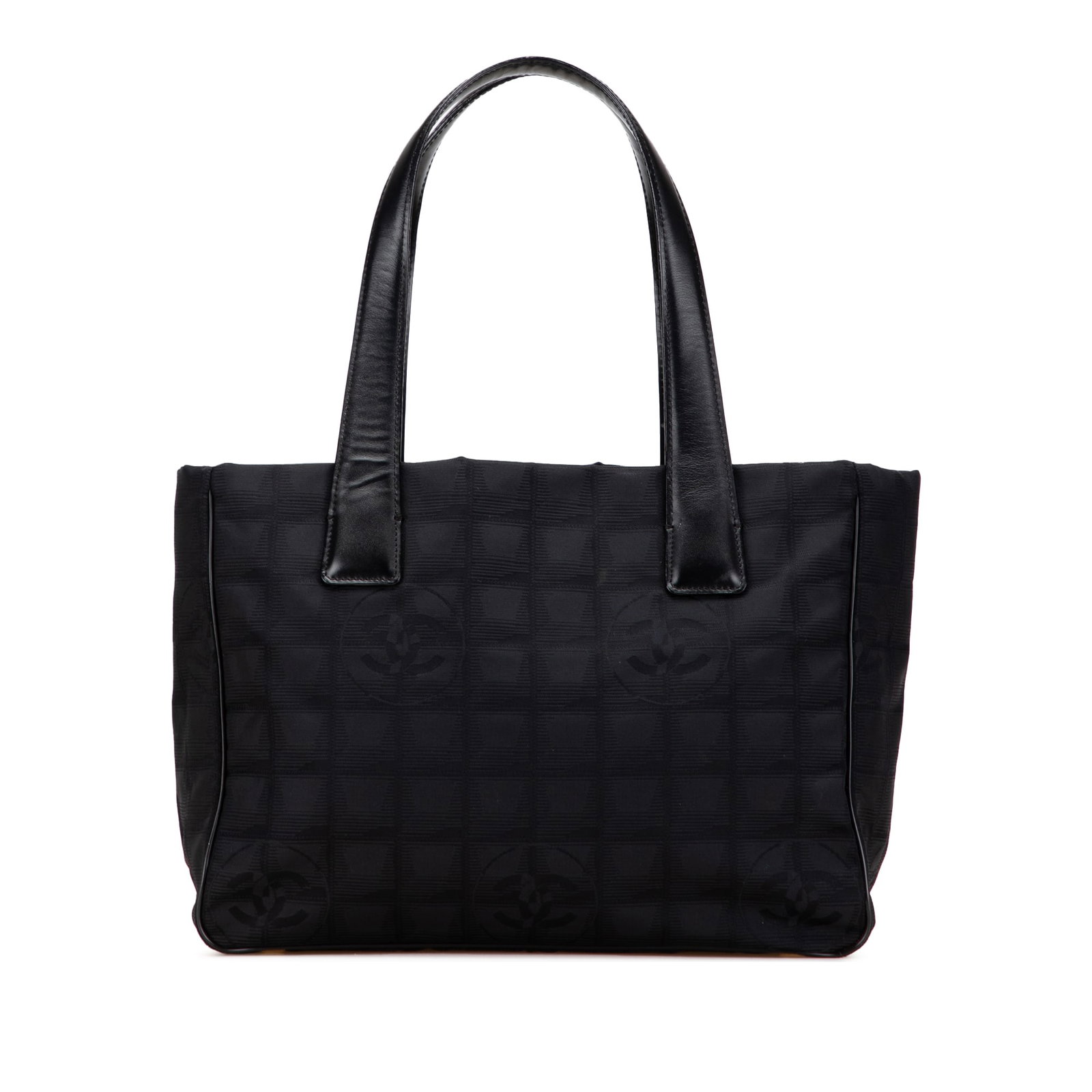 Chanel Black New Travel Line Nylon Tote Bag: Chanel Black New Travel Line Nylon Tote Bag This stylish Chanel New Travel Line Nylon Tote is crafted from durable nylon and features sleek flat leather straps, an open top design, and convenient inte