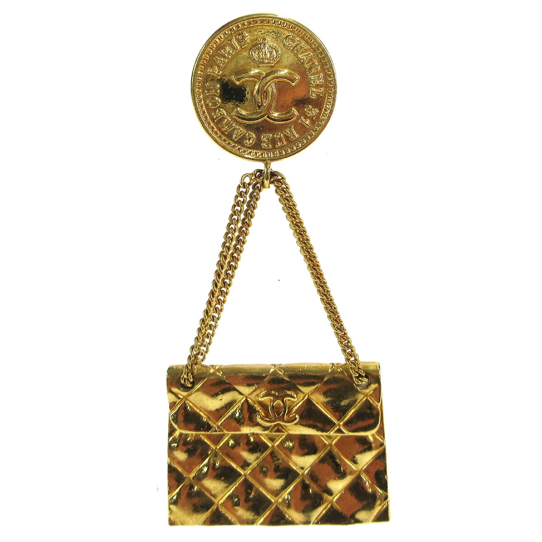 CHANEL 93P Gold Plated CC Quilted Bag Motif Brooch: CHANEL 93P Gold Plated CC Quilted Bag Motif Brooch Gold-plated Chanel brooch in a quilted bag motif with CC logo detail. Made in France, this pin features a gold-tone finish and shows reasonable wear 