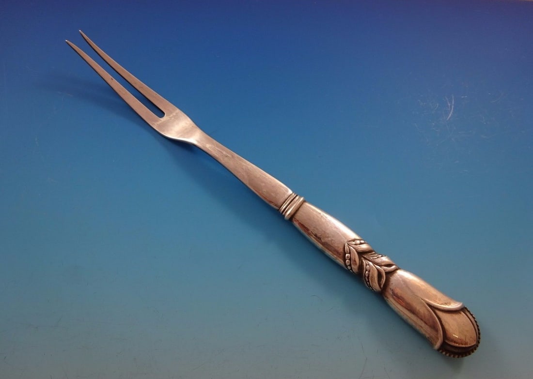 Georg Jensen Ornamental #57 Sterling Silver Buffet Fork 2-Tine 9 3/4 in: Georg Jensen Ornamental #57 Sterling Silver Buffet Fork 2-Tine 9 3/4 in This exquisite Ornamental #57 buffet fork by Georg Jensen is crafted from high-quality sterling silver. Featuring a classic 2-ti
