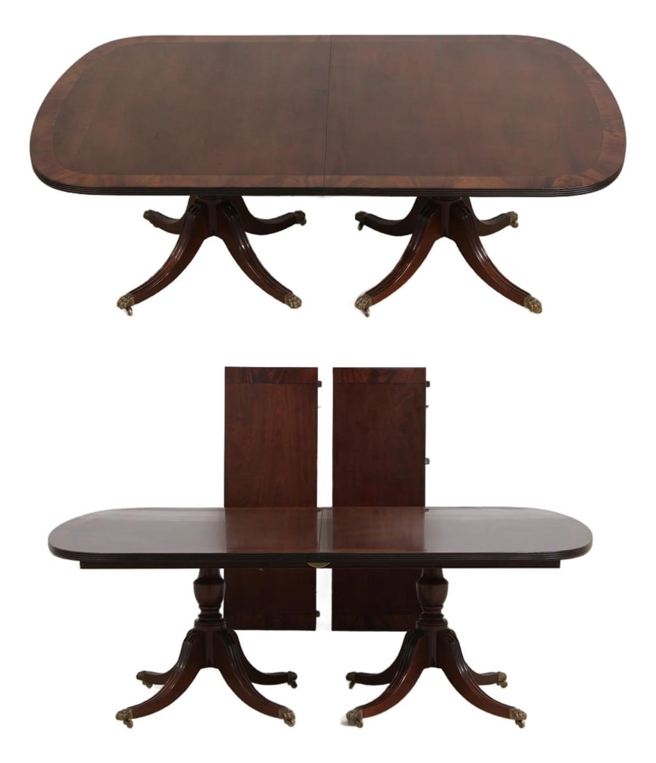 Georgian Style Mahogany Double Pedestal Dining Table With Leaves: Georgian Style Mahogany Double Pedestal Dining Table With Leaves This Georgian style dining table features a banded inlaid mahogany top with two turned pedestals, each supported by ball and claw feet 