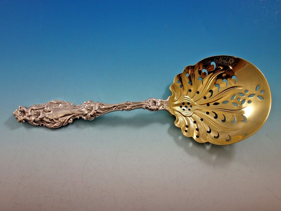Whiting Lily Pattern Gold Washed Sterling Silver Pea Spoon 8 3/4": Whiting Lily Pattern Gold Washed Sterling Silver Pea Spoon 8 3/4" This exquisite serving piece features a pea spoon designed in the elegant 'Lily' pattern by Whiting. Crafted from high-quality sterlin