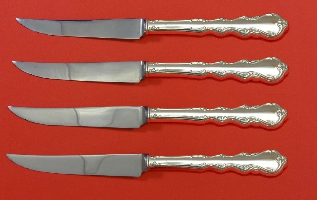 International Angelique Sterling Silver Steak Knife Set 4pc Custom: International Angelique Sterling Silver Steak Knife Set 4pc Custom Enhance your dining experience with this exquisite 4-piece Steak Knife Set from the Angelique pattern by International. Crafted from 