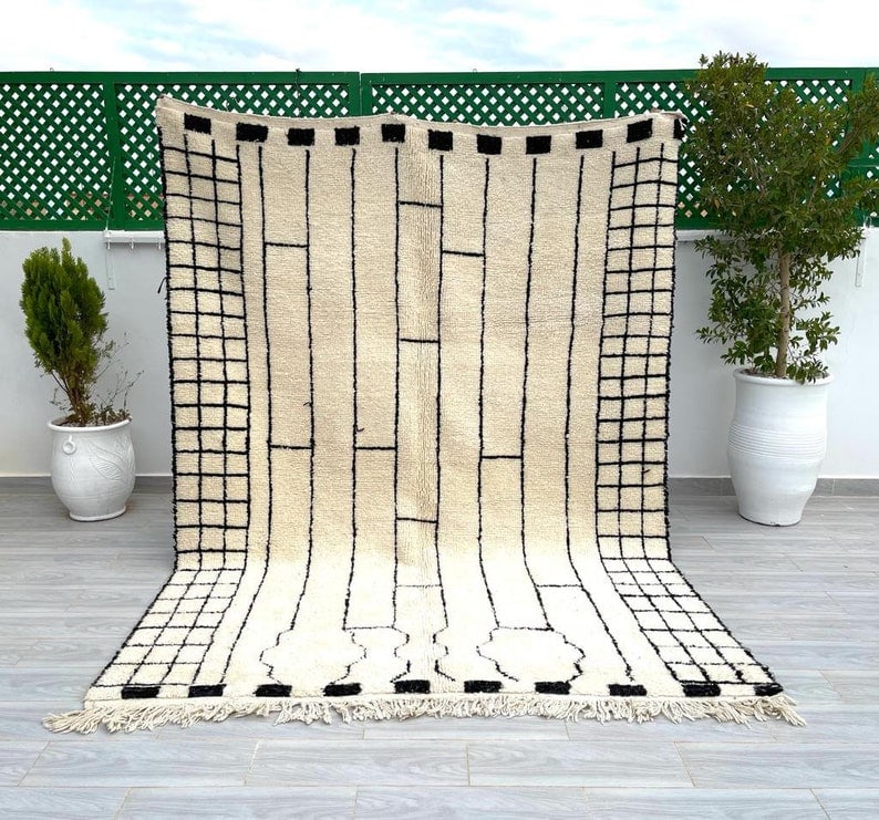 Handmade Moroccan Berber Wool Area Rug Soft White 9.84 x 6.56 ft: Handmade Moroccan Berber Wool Area Rug Soft White 9.84 x 6.56 ft Enhance your space with this stunning Soft White Handmade Moroccan Berber Wool Area Rug. Expertly handwoven by local Berber women in th