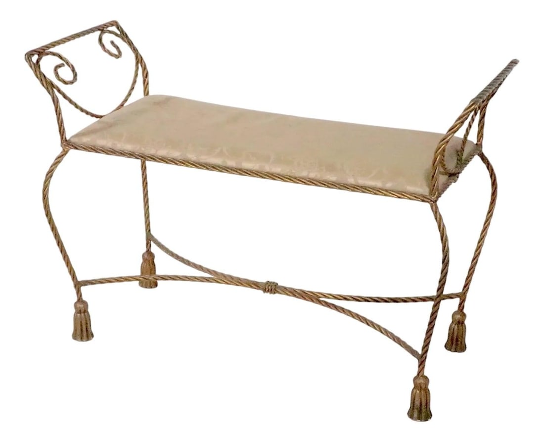 Italian Gold Finish Metal Bench with Tassel Feet: Italian Gold Finish Metal Bench with Tassel Feet This elegant bench features a gold finish metal frame crafted in a twisted rope design, accented with decorative metal tassel feet. The rectangular sea