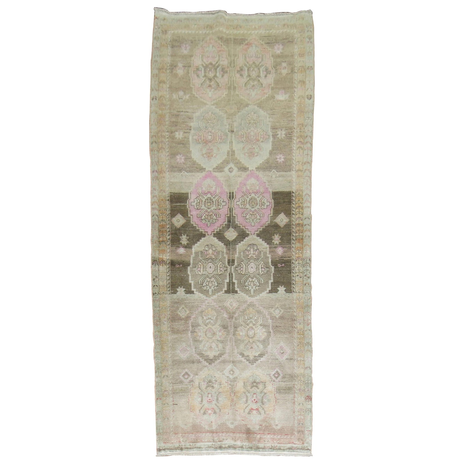 Hand-Woven Wool Turkish Oushak Runner 3'6 x 9'5: Hand-Woven Wool Turkish Oushak Runner 3'6 x 9'5 This Turkish Oushak runner features a hand-woven wool construction with a beige field and accents in brown and pink hues. Originating from Turkey and da