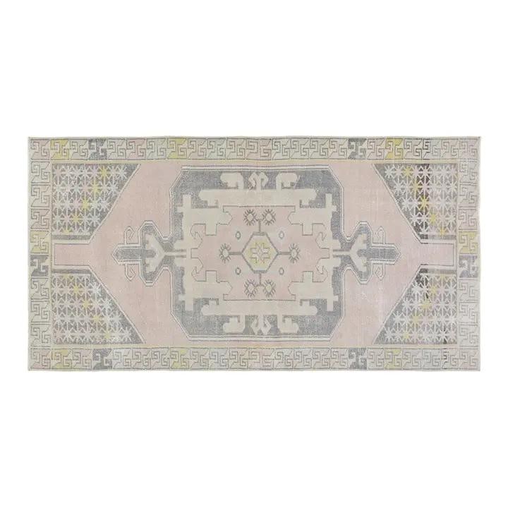 Handmade Wool Anatolian Area Rug in Pink 4'3 x 8'3: Handmade Wool Anatolian Area Rug in Pink 4'3 x 8'3 This vintage Turkish Anatolian hand-knotted wool rug showcases traditional craftsmanship paired with a modern design sensibility. The rug is crafted 