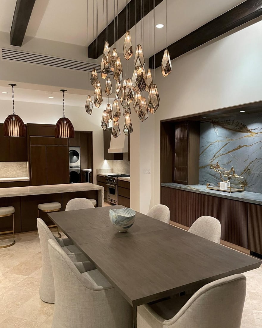 Currey 30-Light Brass Pendant with Raj Mirror Shades: Currey 30-Light Brass Pendant with Raj Mirror Shades Illuminate your space with this elegant 30-light pendant featuring stunning Raj mirror shades. This multi-drop pendant light showcases a contempora