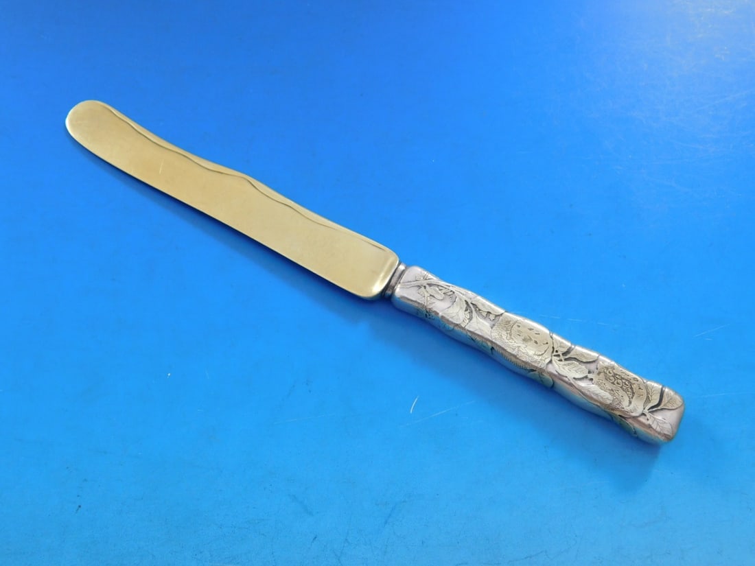 Tiffany & Co. Lap Over Edge Sterling Silver Dessert Knife with Gold Accents: Tiffany & Co. Lap Over Edge Sterling Silver Dessert Knife with Gold Accents This exquisite dessert knife features the classic Lap Over Edge pattern by Tiffany & Co., made from high-quality sterling si
