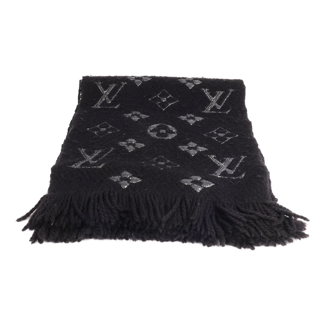 Black Wool Silk Logomania Shine Scarf by Louis Vuitton M75833: Black Wool Silk Logomania Shine Scarf by Louis Vuitton M75833 This Louis Vuitton Logomania Shine scarf is crafted from a blend of wool and silk in black. Designed for women, it offers a stylish and ve