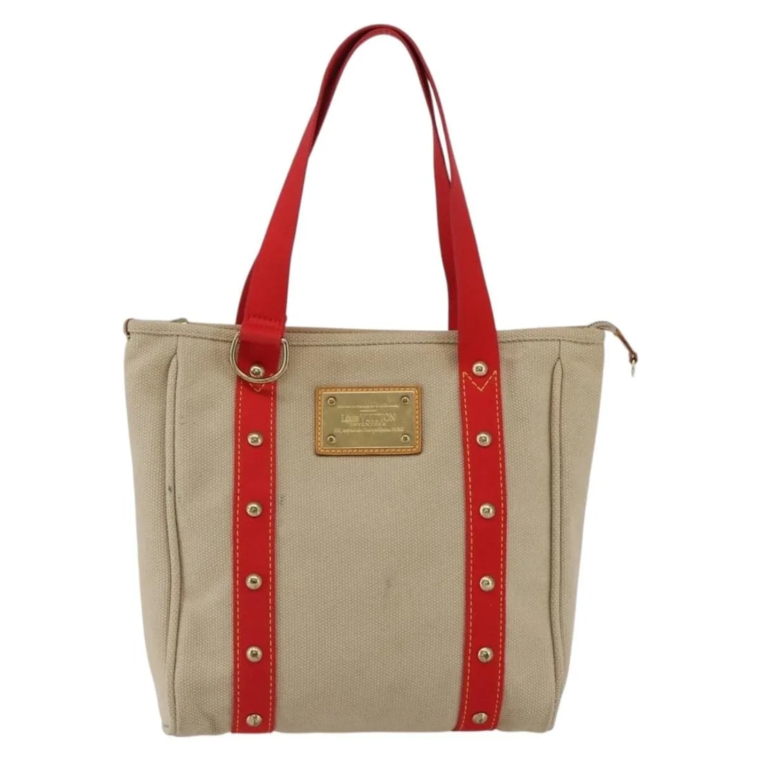 Beige Antigua Tote by Louis Vuitton Canvas France 29cm x 30cm x 9.5cm: Beige Antigua Tote by Louis Vuitton Canvas France 29cm x 30cm x 9.5cm This Louis Vuitton Antigua Tote is crafted from beige canvas and designed for women. The tote features signs of use, including sur