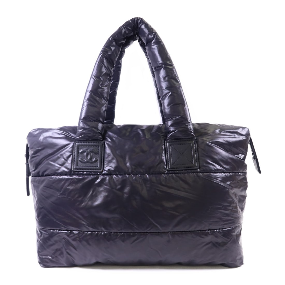 CoCo Cocoon Black Nylon Shoulder Bag by CHANEL with Silver Hardware: CoCo Cocoon Black Nylon Shoulder Bag by CHANEL with Silver Hardware This Chanel CC CoCo Cocoon shoulder bag features a black nylon exterior and a spacious design, offering both style and practicality.