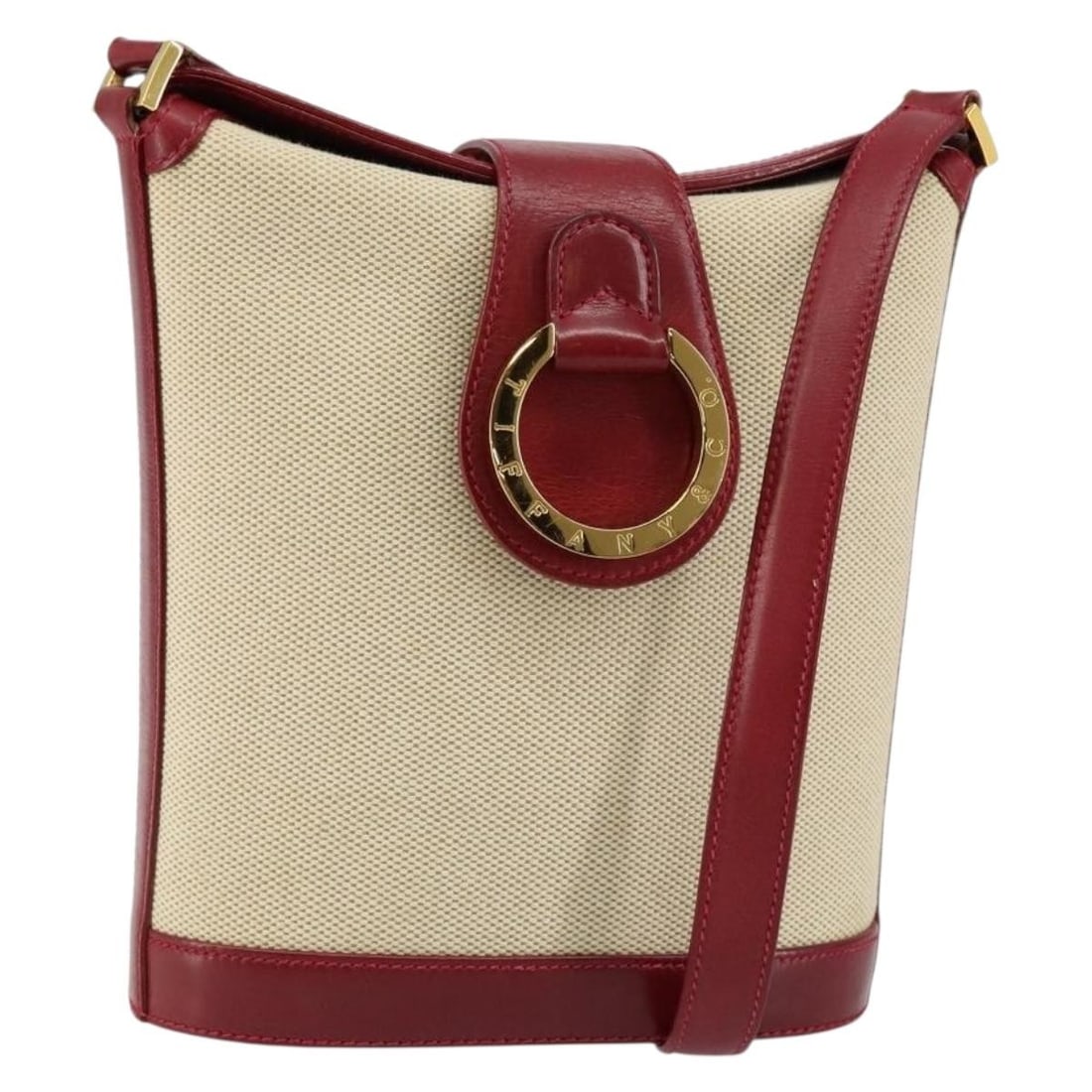 TIFFANY&Co. Beige Gold Canvas Shoulder Bag Italy Auth 146483: TIFFANY&Co. Beige Gold Canvas Shoulder Bag Italy Auth 146483 This stylish shoulder bag from TIFFANY&Co. features a chic beige and gold canvas exterior, crafted in Italy. Its compact dimensions make it