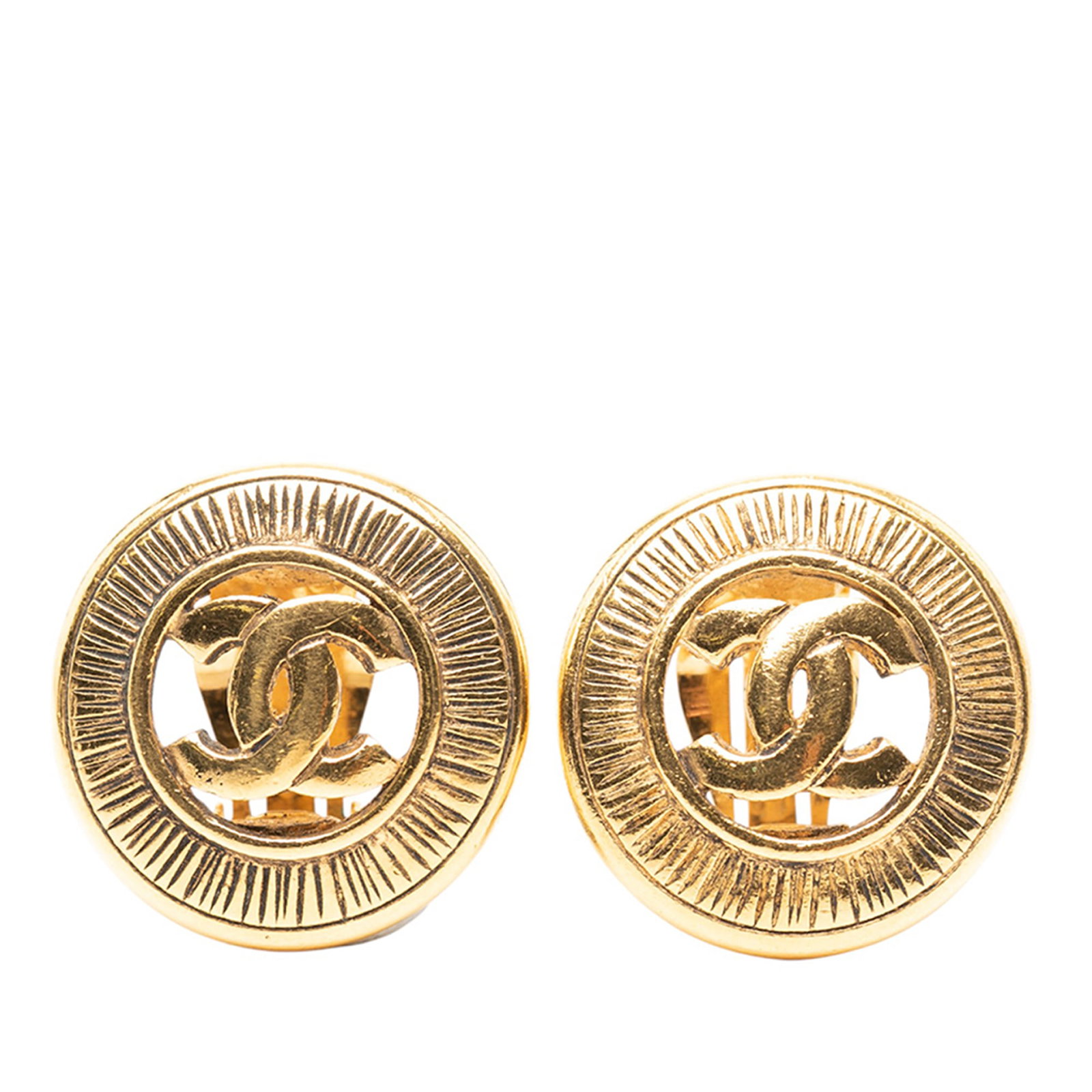 Chanel Round Gold Plated Metal Clip On CC Earrings: Chanel Round Gold Plated Metal Clip On CC Earrings These Chanel round clip-on earrings feature a gold-plated metal body with signature CC design. Made in France, they are classified as costume jewelry