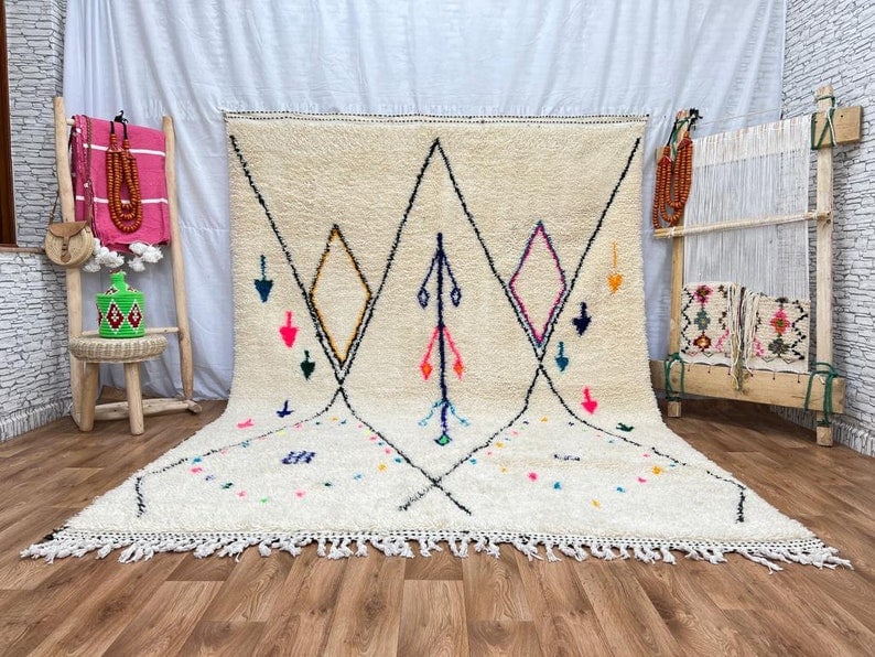 Authentic Handwoven White Rug from Morocco 10 x 5 Feet: Authentic Handwoven White Rug from Morocco 10 x 5 Feet This authentic white rug is handwoven in the Atlas Mountains by local Berber women weavers, utilizing traditional tools and natural local wool. I