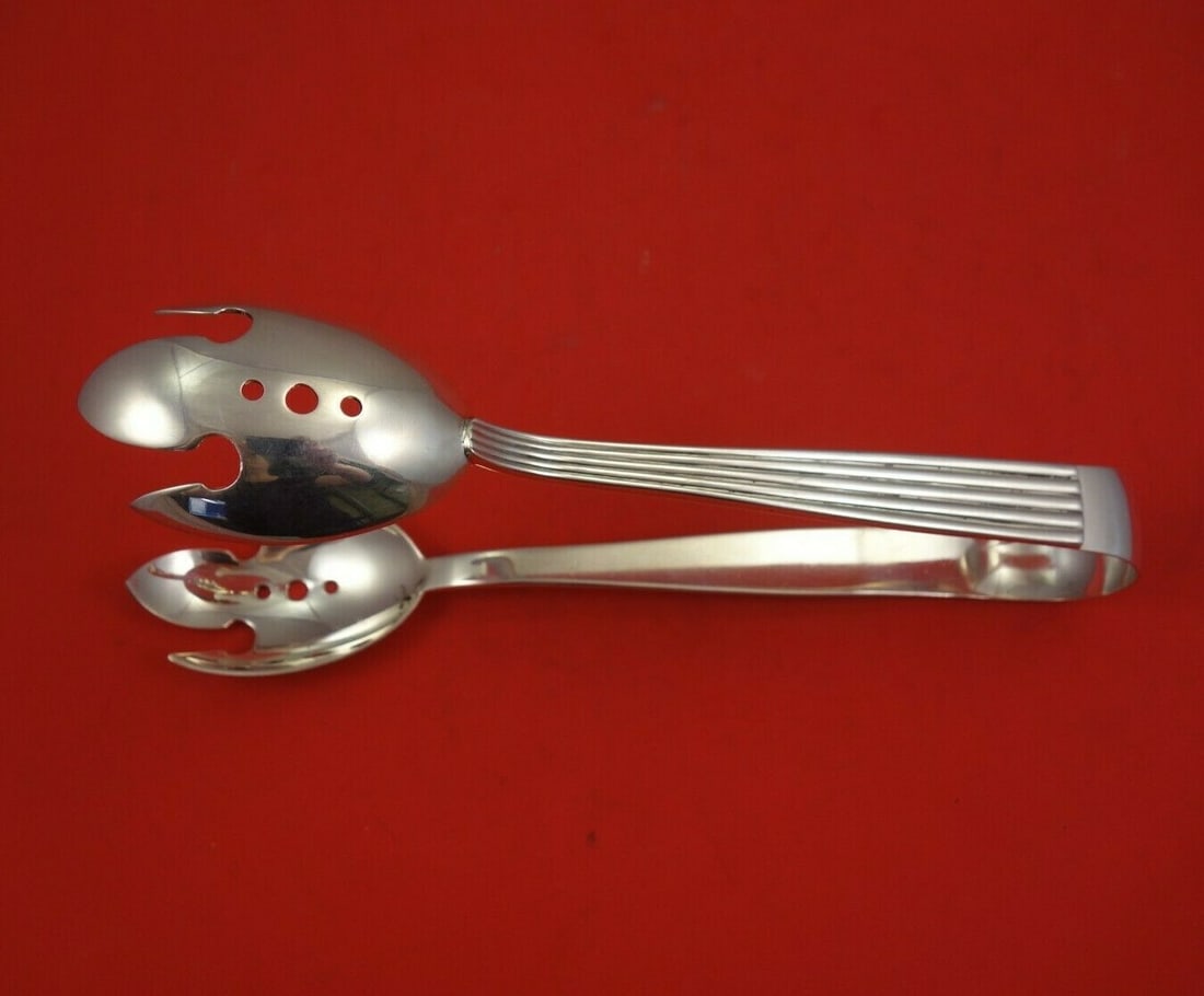 Buccellati Tiber Sterling Silver Ice Tong 8 3/4 Inches Serving Piece: Buccellati Tiber Sterling Silver Ice Tong 8 3/4 Inches Serving Piece Elevate your serving experience with the Tiber Ice Tong by Buccellati, crafted from high-quality sterling silver. This exquisite pi