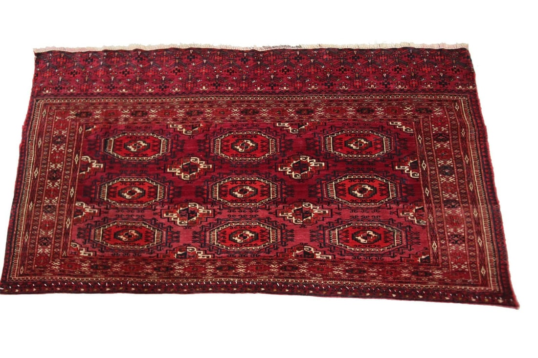 Hand Knotted Wool Turkoman Area Rug 2'7 x 5' Geometric Purple Red: Hand Knotted Wool Turkoman Area Rug 2'7 x 5' Geometric Purple Red This exceptional antique handmade rug, dating to circa 1910, is a genuine hand-knotted piece originating from Turkmenistan. Featuring 