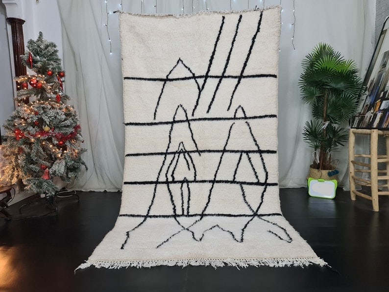Authentic Soft Handmade Moroccan Berber Wool Rug 6.56 x 3.28 Feet: Authentic Soft Handmade Moroccan Berber Wool Rug 6.56 x 3.28 Feet Enhance your living space with this authentic handmade Moroccan Berber wool rug, showcasing a soft white base adorned with a unique bl
